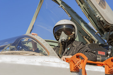 Image showing Military pilot in the cockpit of a jet aircraft