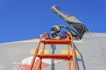 Image showing Military pilot in the cockpit of a jet aircraft