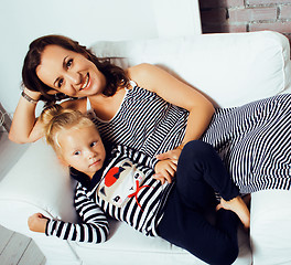 Image showing Portrait of smiling young mother and daughter at home, happy fam