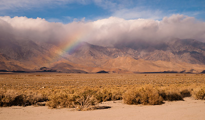 Image showing Rainbow Storm Brewing Rain Falling Sierra Nevada Range