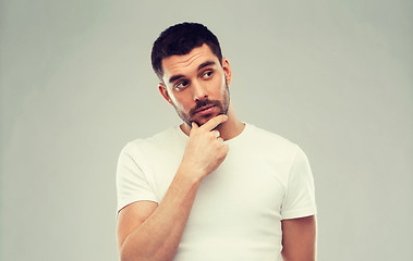 Image showing man thinking over gray background