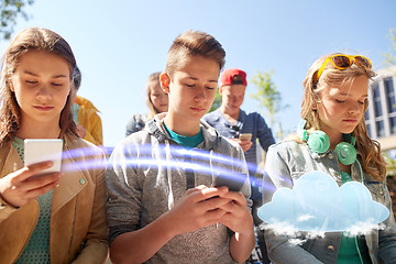 Image showing group of teenage friends with smartphones outdoors