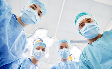 Image showing group of surgeons in operating room at hospital