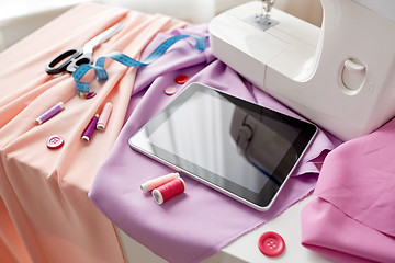 Image showing sewing machine, tablet pc, scissors and ruler