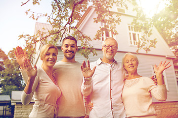 Image showing happy family in front of house outdoors