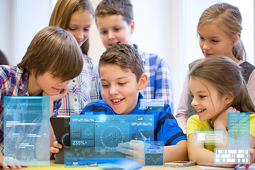 Image showing group of school kids with tablet pc in classroom