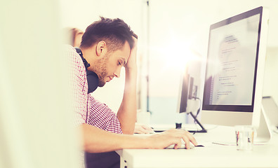 Image showing stressed software developer at office