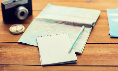 Image showing close up of notepad with map and travel tickets