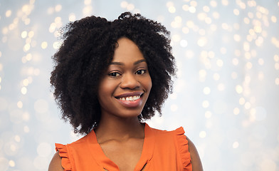 Image showing happy african american young woman over white