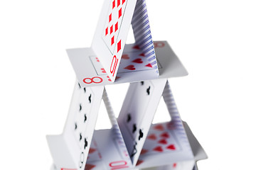 Image showing house of playing cards over white background