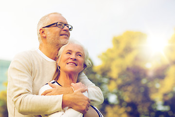 Image showing senior couple hugging in park