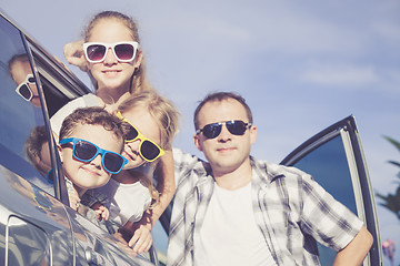 Image showing Happy family getting ready for road trip on a sunny day