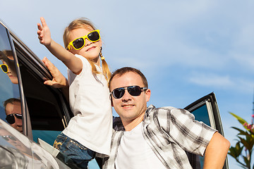 Image showing Happy father and daughter getting ready for road trip on a sunny