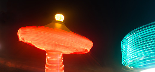 Image showing Local State Fair Carnival Ride Long Exposure Red Blue Streaks