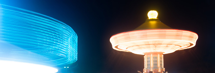 Image showing Local State Fair Carnival Ride Long Exposure Red Blue Streaks