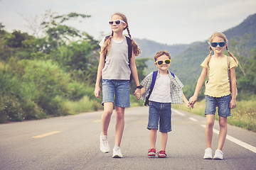 Image showing Happy children walking on the road.