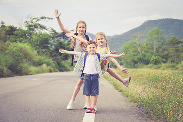 Image showing Happy children walking on the road.