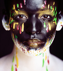 Image showing woman with creative makeup closeup like drops of colors, facepai