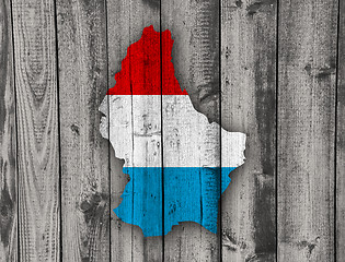 Image showing Map and flag of Luxembourg on weathered wood