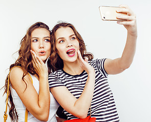 Image showing best friends teenage girls together having fun, posing emotional on white background, besties happy smiling, lifestyle people concept close up