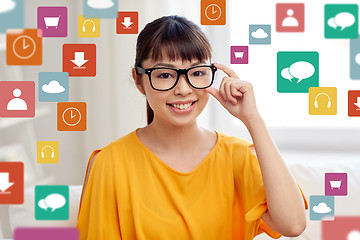 Image showing happy asian young woman in glasses at home