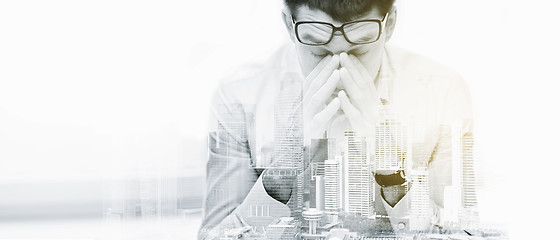 Image showing tired businessman with eyeglasses at office