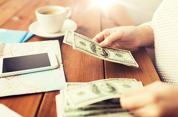 Image showing close up of traveler hands counting dollar money