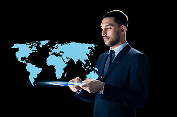 Image showing businessman with tablet pc and world map