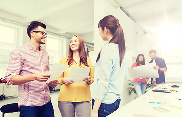 Image showing creative team on coffee break talking at office