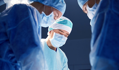 Image showing group of surgeons in operating room at hospital