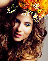 Image showing Beauty young woman with flowers and make up close up, real sprin