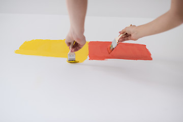 Image showing couple painting interior wall