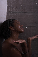 Image showing African American woman in the shower