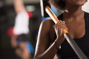 Image showing black woman after workout with hammer