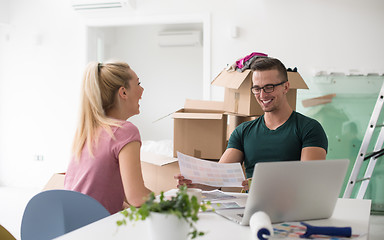 Image showing Young couple moving in a new home