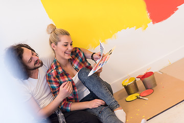 Image showing Happy young couple relaxing after painting