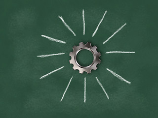Image showing gear wheel on chalkboard with sunbeams - 3d rendering