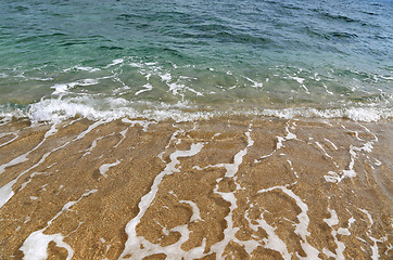 Image showing Clear sea water in the coastal sand