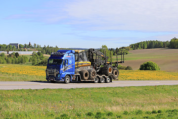 Image showing Volvo FH Hauls Ponsse Forest Machinery at Summer 
