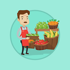 Image showing Supermarket worker with box full of apples.