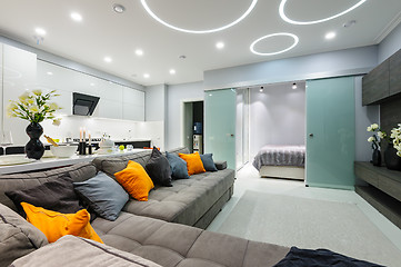 Image showing Modern white living studio with bedroom doors open