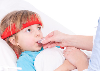 Image showing Sick little girl in bed