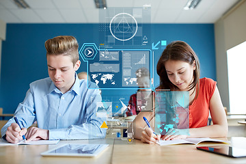 Image showing group of students with books writing school test