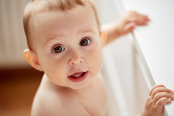 Image showing happy little baby boy or girl at home