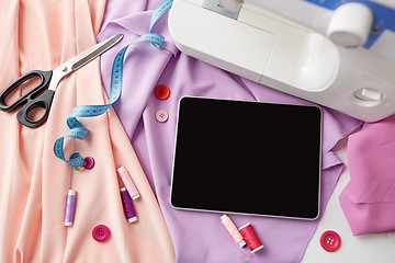 Image showing sewing machine, tablet pc, scissors and ruler