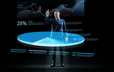 Image showing businessman working with virtual chart hologram