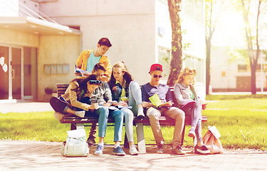 Image showing group of students with notebooks at school yard