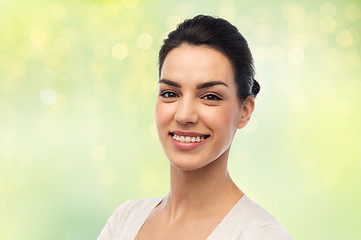 Image showing happy smiling young woman with braces