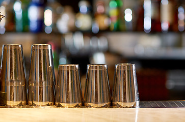 Image showing stainless steel shakers on bar counter