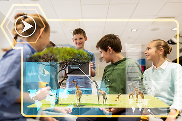 Image showing group of happy children with tablet pc at school